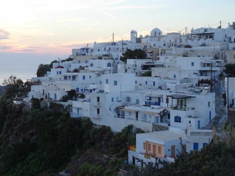 Whitewashed Cycladic houses of Plaka village on the hillside of Milos