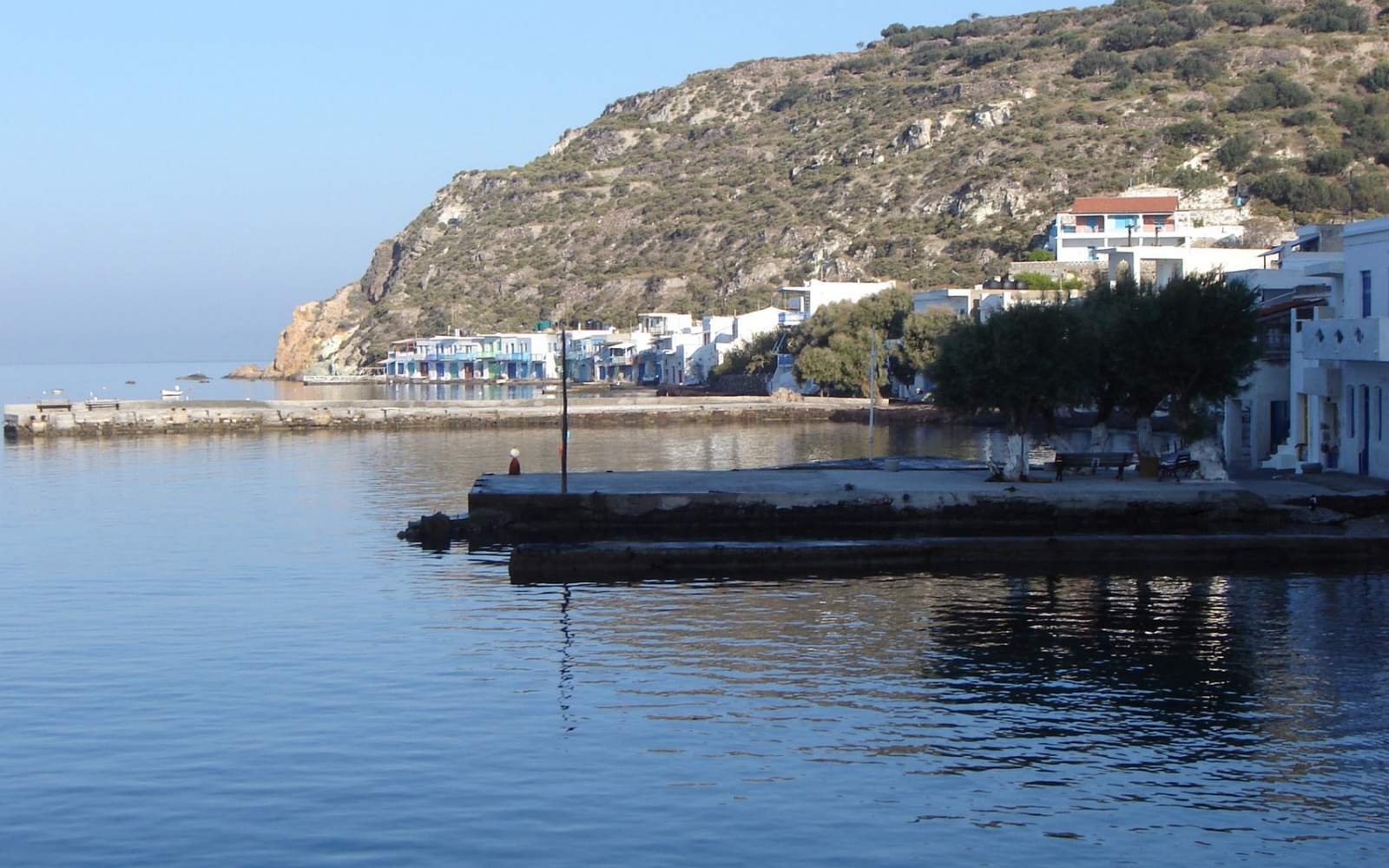 Colourful fishermen's houses beside the water in a seaside village on Milos